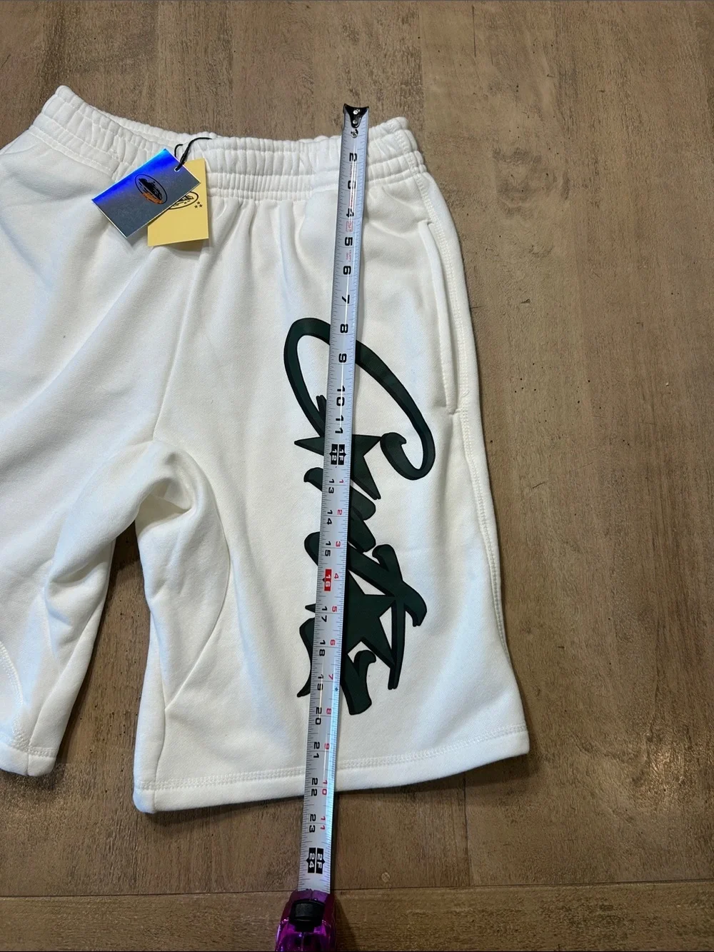 Corteiz Men's White Athletic Shorts with Dark Script Accent Medium